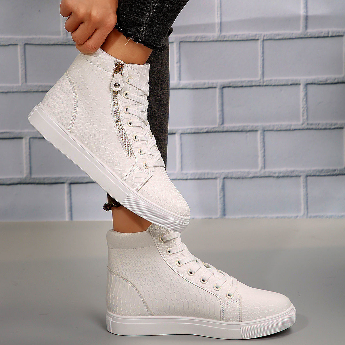 Side on-foot view of the women’s Brielle Luxe Zip-Wedge High-Top Sneakers in Beige, featuring a light neutral ankle-high upper, coordinating lace-up closure, subtle textured paneling, side zipper detail, rounded toe, concealed wedge-inspired profile, and thick light-colored sole for chic everyday Fall and Winter outfits.