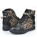 Pair of women's Harper Wild Side High-Top Sneakers featuring Black and leopard-print panels, high-top ankle construction, dark lace-up fronts, rounded black toes, statement animal-print detailing, and sturdy dark soles for an edgy fashion-forward look.