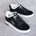 Angled pair view of the Sienna Cozy Plush-Lined Platform Sneakers in Black, featuring sleek black lace-up uppers, contrasting soft white plush lining, rounded toes, low-top construction, and thick white platform soles for stylish and comfortable Fall and Winter outfits.