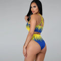 Azaria blue-and-yellow bikini shown from a rear side view, featuring a vibrant gradient-print cropped top with crisscross back straps and matching high-waisted bottoms with high-cut legs.
