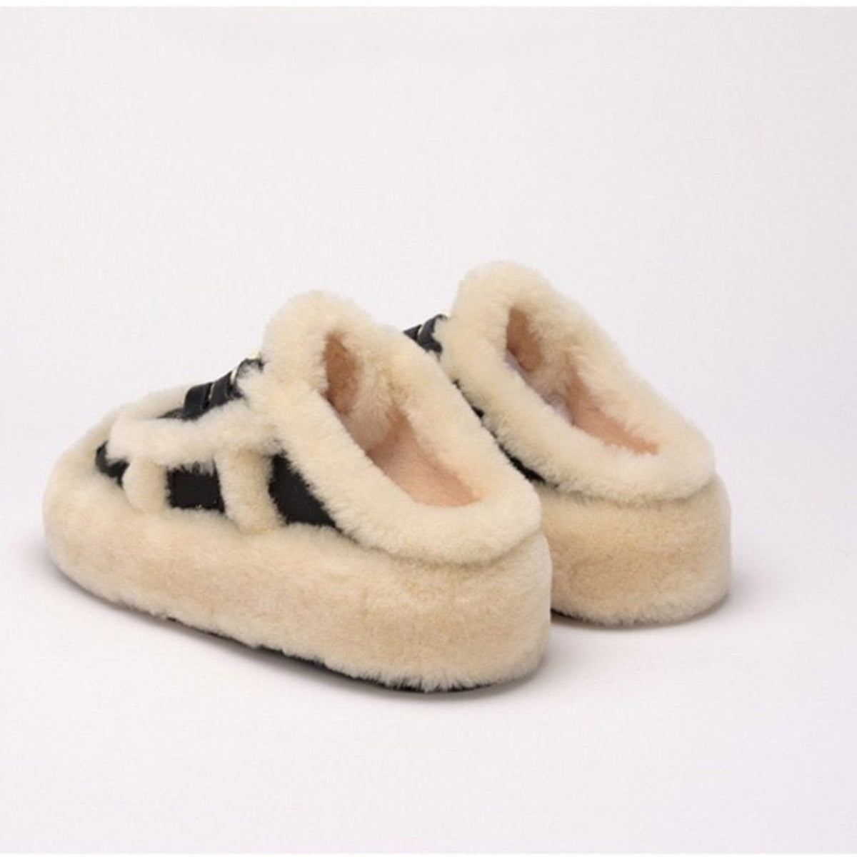 Black and white women's plush thick-sole slippers shown from the back