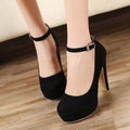 Black Brielle Platform Mary Jane Chunky Heel Pumps shown from a front three-quarter angle, highlighting the rounded toe box, raised platform sole, high chunky heel, and classic ankle strap closure.