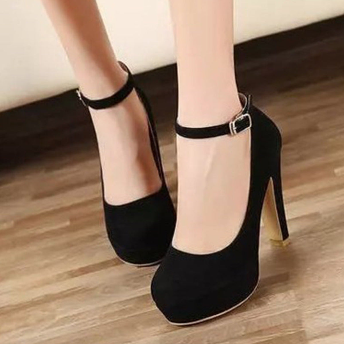 Black Brielle Platform Mary Jane Chunky Heel Pumps shown from a front three-quarter angle, highlighting the rounded toe box, raised platform sole, high chunky heel, and classic ankle strap closure.