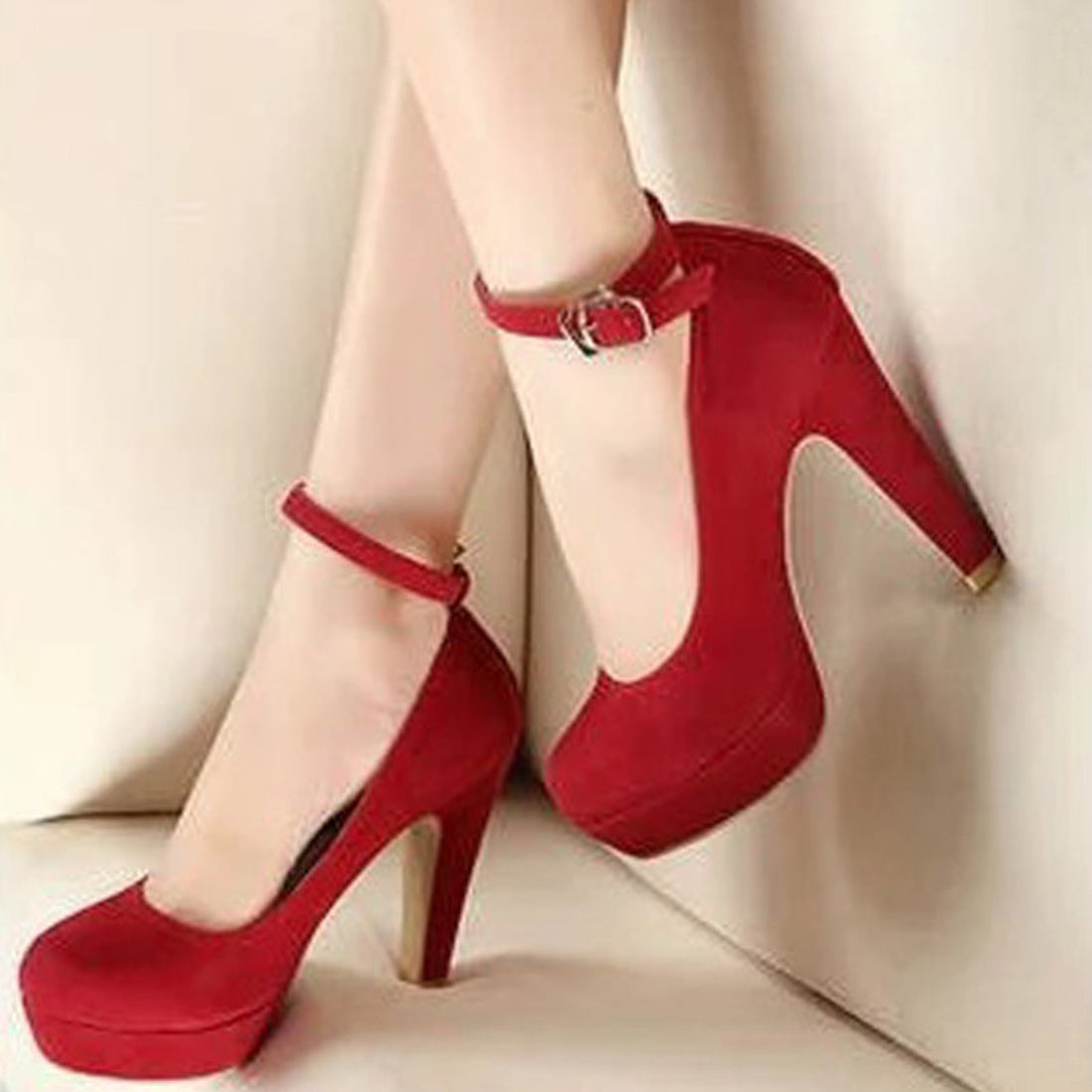 Black Brielle Platform Mary Jane Chunky Heel Pumps worn on a model, featuring a rounded closed toe, thick platform front, high chunky heel, adjustable ankle strap, and soft black finish.