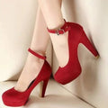 Red Brielle Platform Mary Jane Chunky Heel Pumps worn on a model, featuring a rich red finish, rounded toe, substantial front platform, high block-style heel, and adjustable ankle strap.