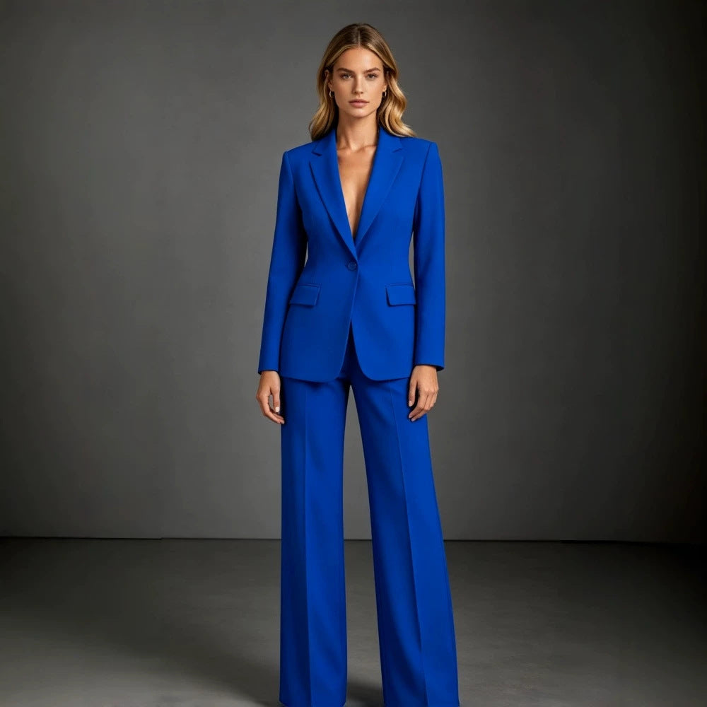 Camille women's royal blue blazer and pants suit shown on a model, featuring a fitted single-breasted blazer with long sleeves, tailored lapels, and matching wide-leg trousers in a vibrant blue finish.