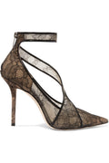 Black lace high-heeled shoes on a white background side view.