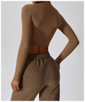 Caramel mocha CloudFlex women’s cropped long-sleeve workout top shown in a back view