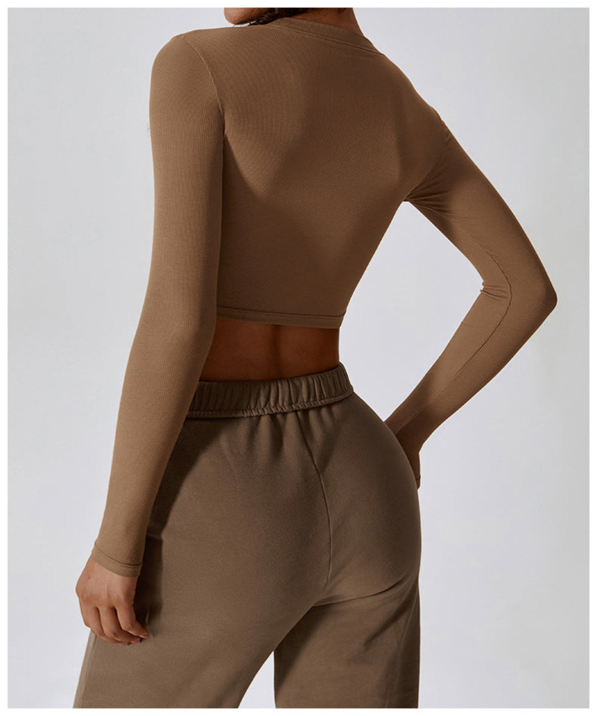 Caramel mocha CloudFlex women’s cropped long-sleeve workout top shown in a back view