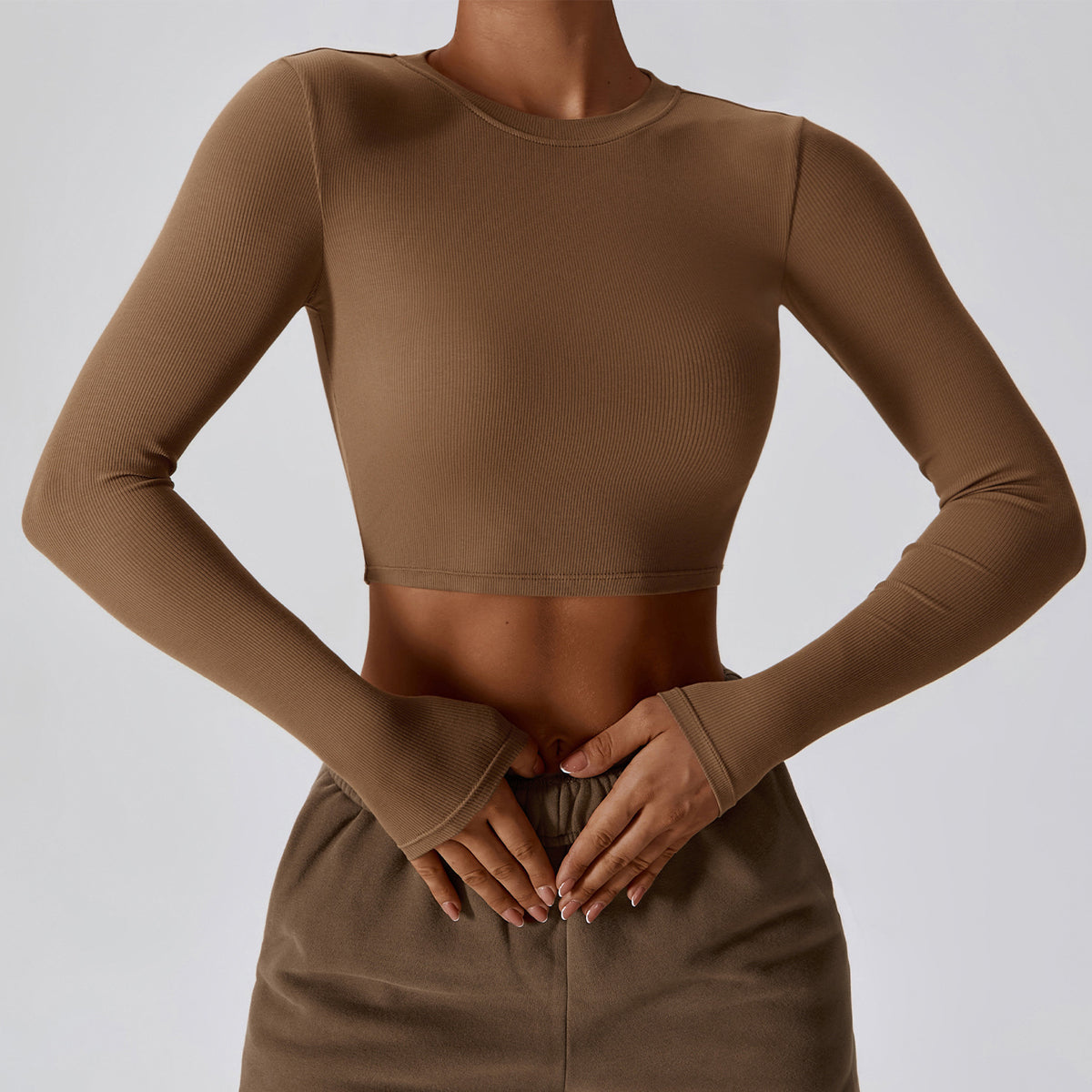 Caramel mocha CloudFlex women’s cropped long-sleeve workout top shown from the front