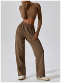 Caramel mocha CloudFlex women’s cropped long-sleeve workout top styled with matching pants in a full-body view