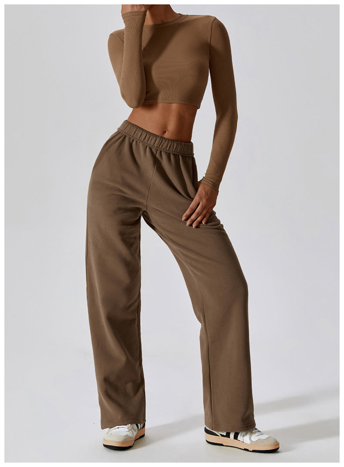 Caramel mocha CloudFlex women’s cropped long-sleeve workout top styled with matching pants in a full-body view
