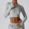 Flower gray CloudFlex women’s cropped long-sleeve workout top shown in an angled front view