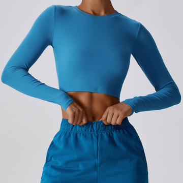 Peacock blue CloudFlex women’s cropped long-sleeve workout top shown from the front