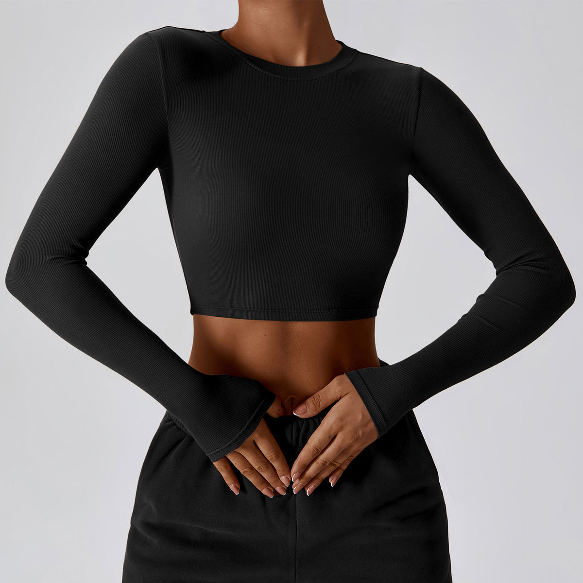 Premium black CloudFlex women’s cropped long-sleeve workout top shown from the front