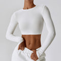Swan white CloudFlex women’s cropped long-sleeve workout top shown in an angled front view