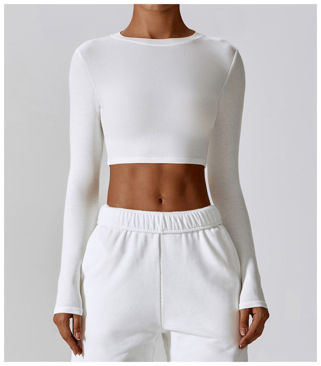 Peacock blue CloudFlex women’s cropped long-sleeve workout top shown from the front