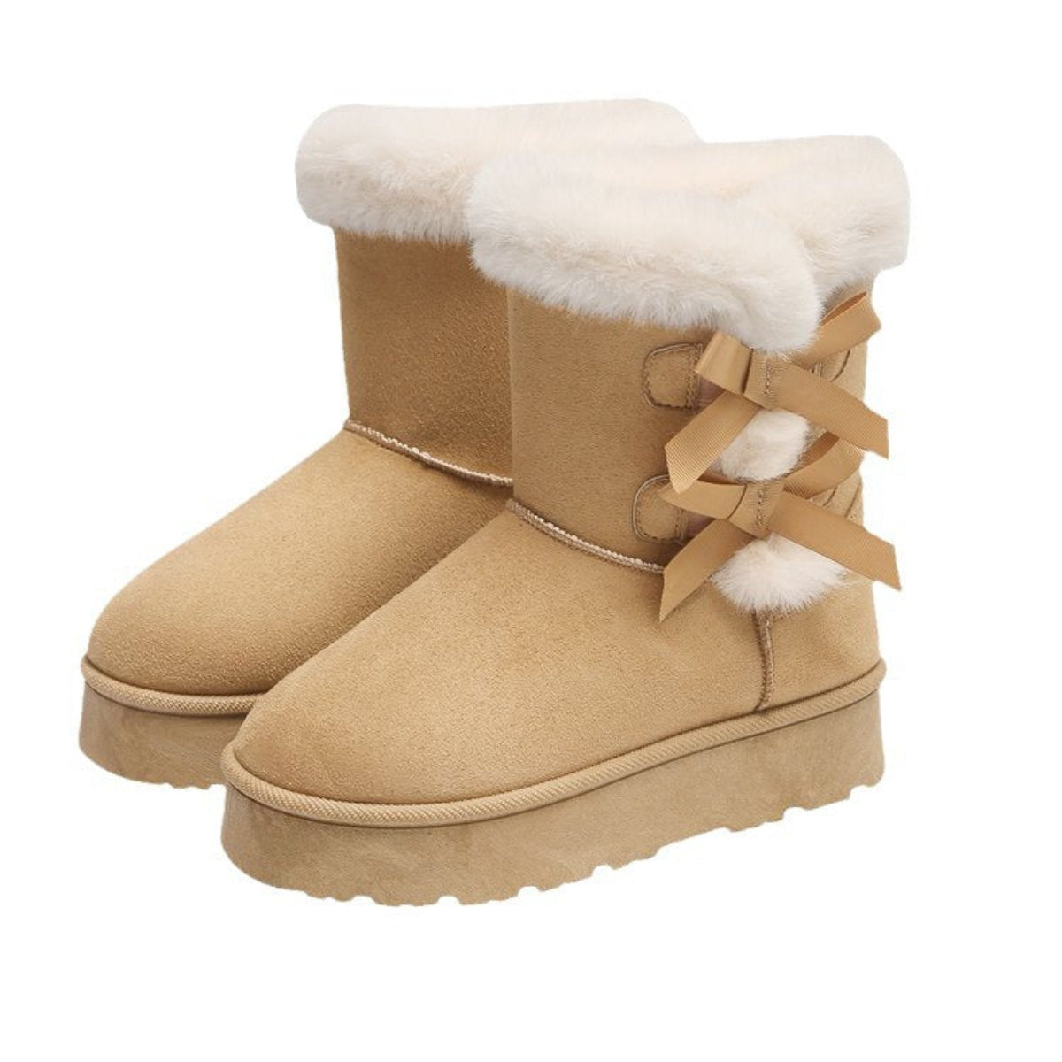 Women’s beige Cozy Belle ankle boots featuring thick plush white fleece trim, decorative side bow accents, rounded toes, visible stitching, and a chunky winter sole.
