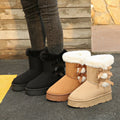 Women’s Cozy Belle fleece-lined ankle boots displayed in Black, Camel, and Beige, featuring plush white faux-fur cuffs, decorative side bows, thick soles, and cozy winter-ready ankle-height silhouettes.
