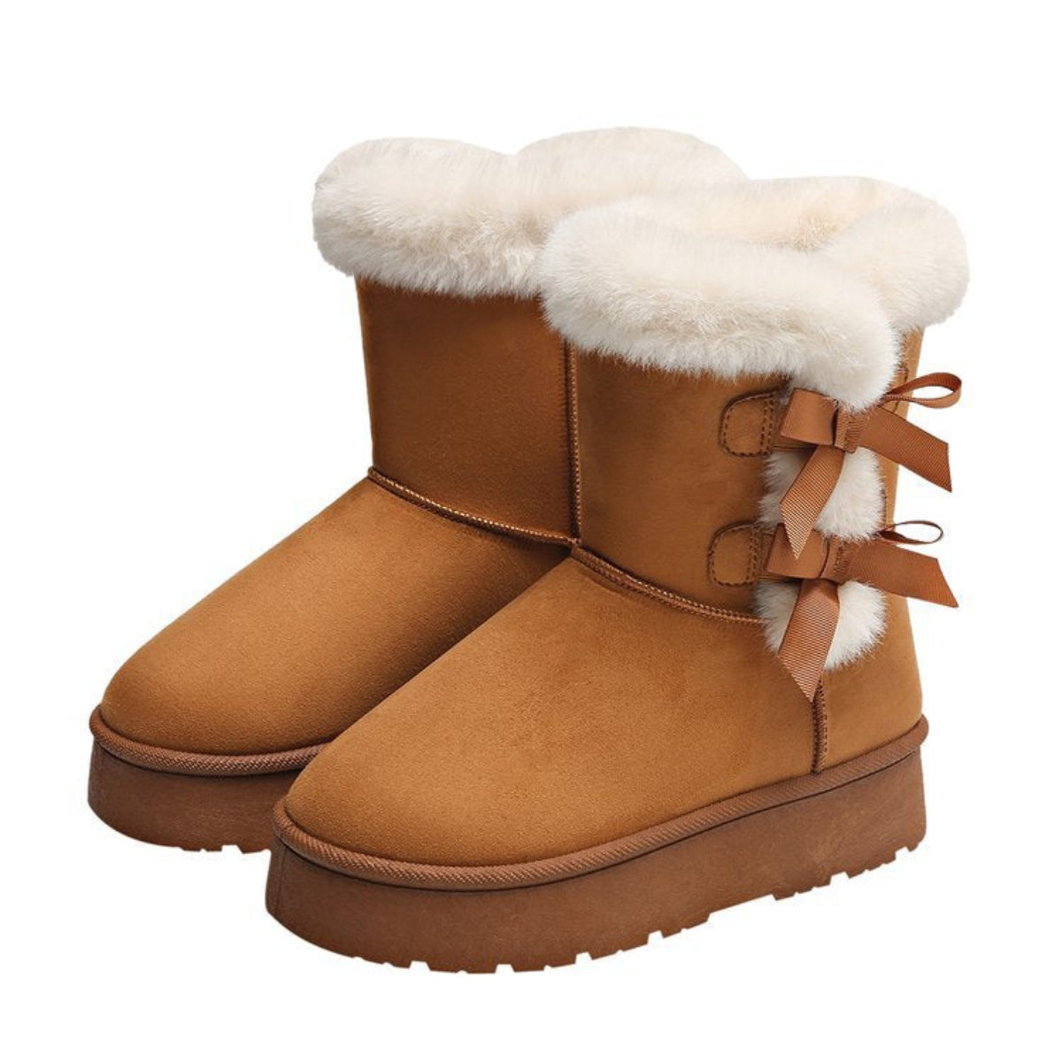 Women’s camel Cozy Belle fleece-lined ankle boots featuring plush white faux-fur cuffs, double decorative side bow accents, rounded toes, visible contrast stitching, soft suede-style uppers, and thick brown platform soles shown as a pair against a clean white background.
