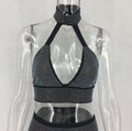Close-up of sparkling crystal detailing on women's two-piece skirt set.