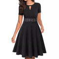 Black lace-waist fit and flare dress with short sleeves, keyhole neckline, and flattering flared skirt.