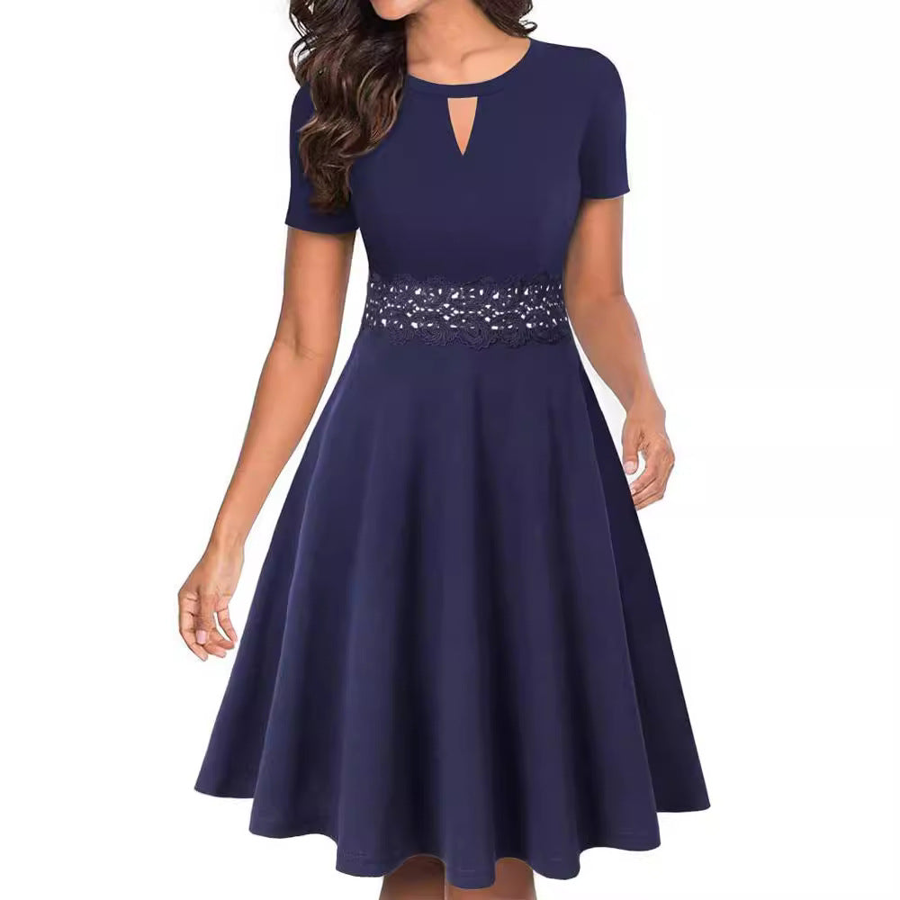 Navy blue lace-waist fit and flare dress with short sleeves, keyhole neckline, and feminine flared silhouette.
