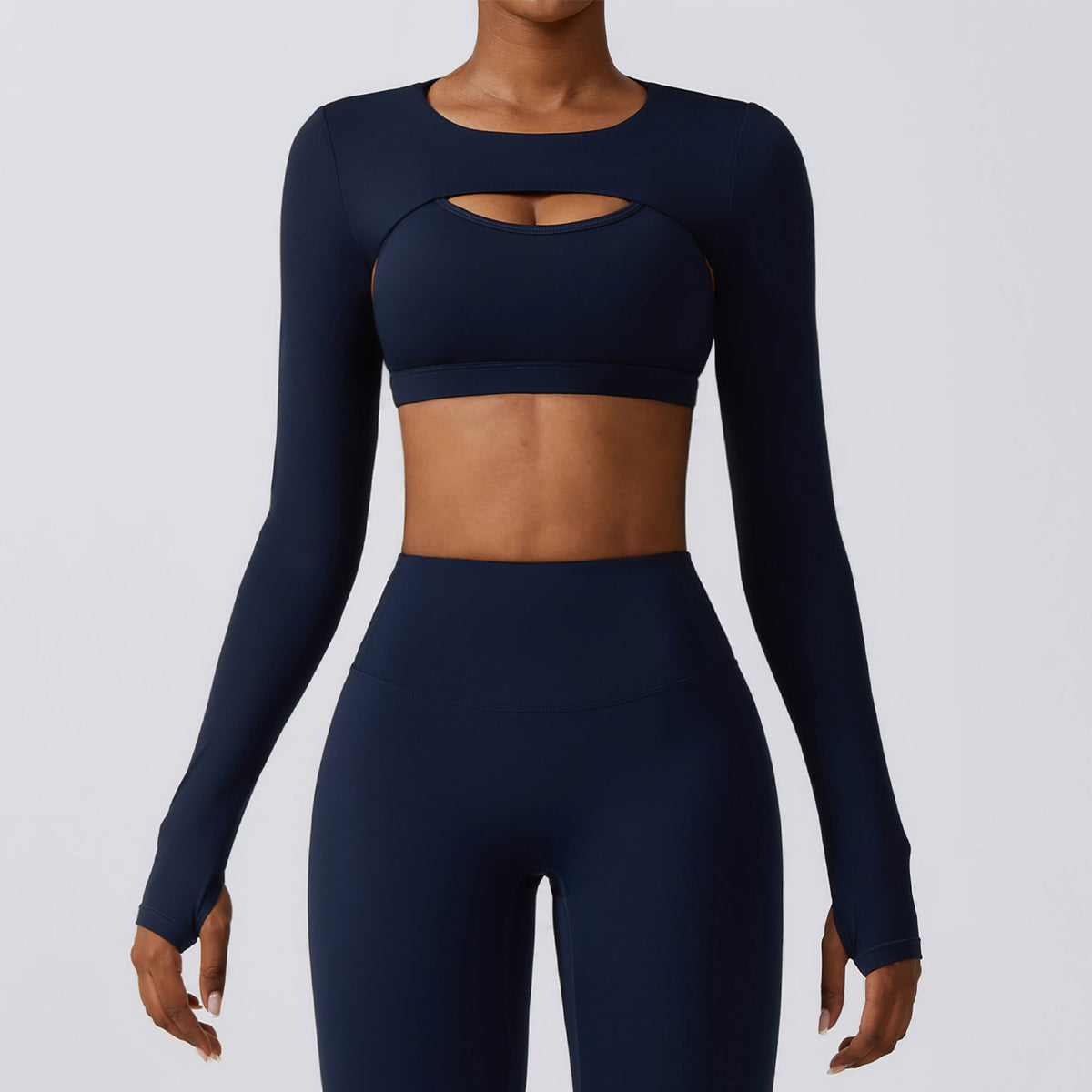 Badge blue Elevate women’s seamless workout set with long-sleeve crop top and high-waist leggings shown from the front