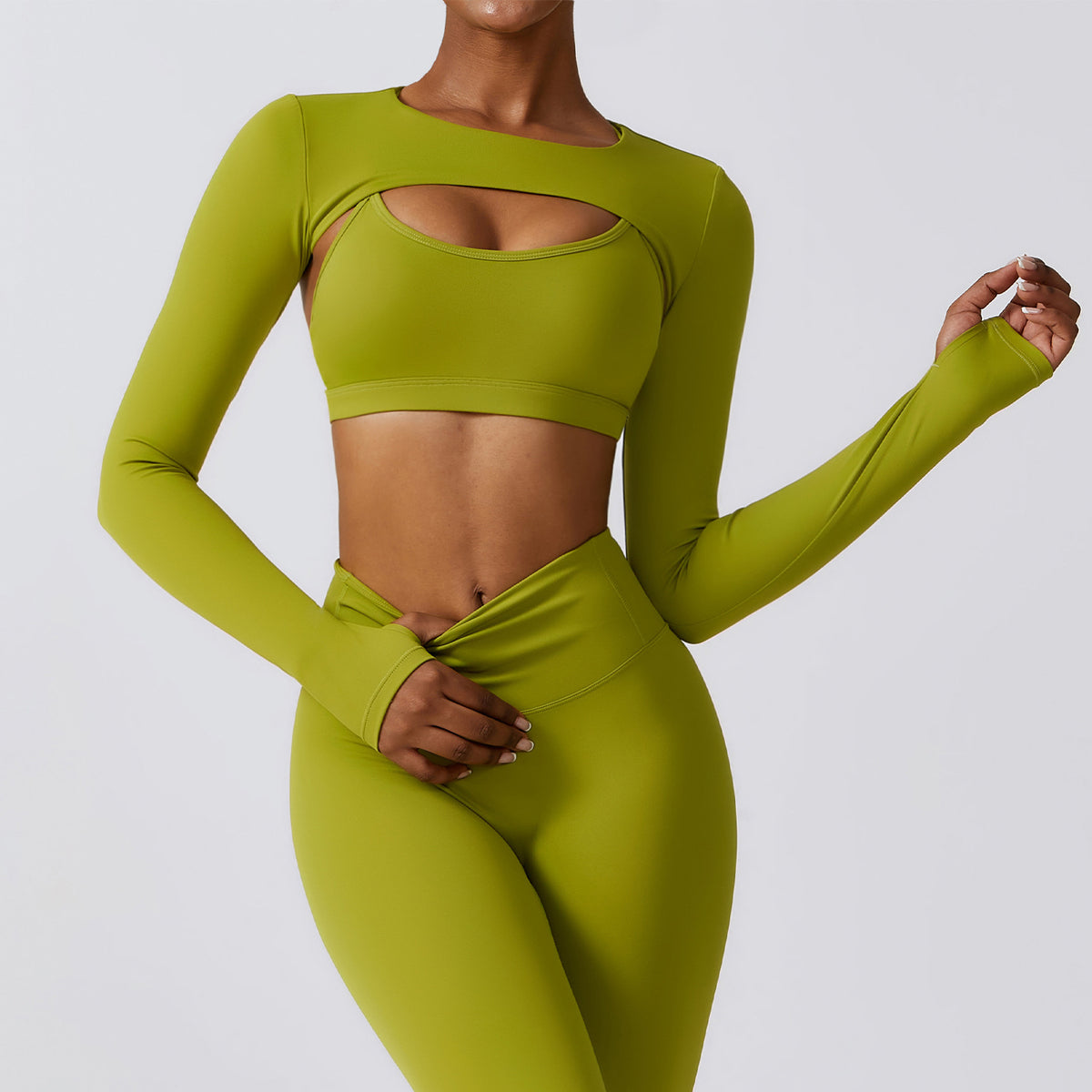 Matcha green Elevate women’s seamless workout set with long-sleeve crop top and high-waist leggings shown from the front