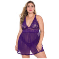 Front view of the Eliana purple lace babydoll nightdress worn by a brunette model, featuring a deep V-shaped neckline with delicate floral lace, narrow shoulder straps, an empire-style underbust seam, and a gently flowing sheer purple mesh skirt with a short hemline.