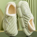 Green quilted women's house slippers with plush lining