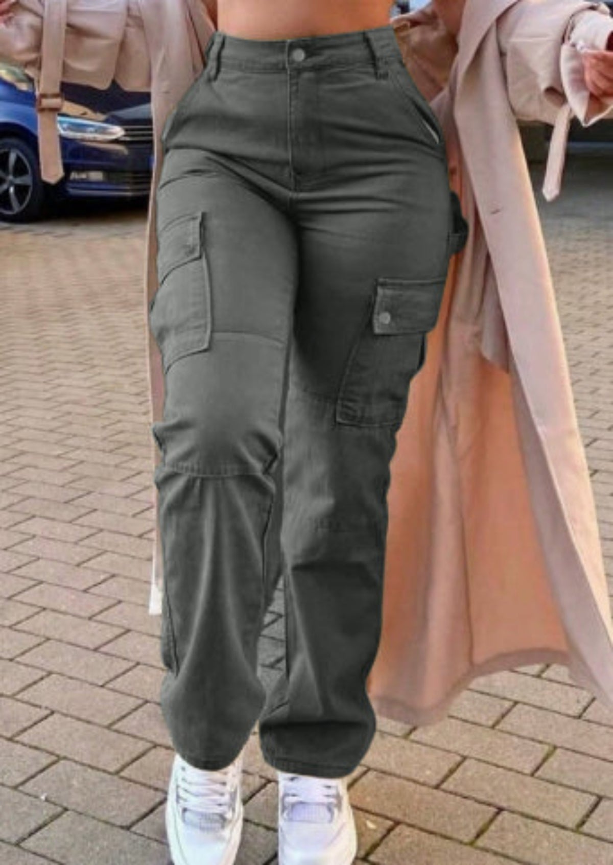 Women's dark gray high-waist stretch cargo pants with utility pockets, front view