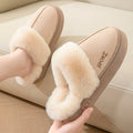 Khaki cozy plush-lined women's slippers worn indoors