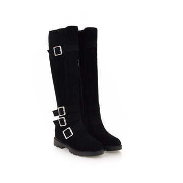 Women’s black tall Martin boots with buckle accents and a sleek riding-inspired silhouette shown in a front view.