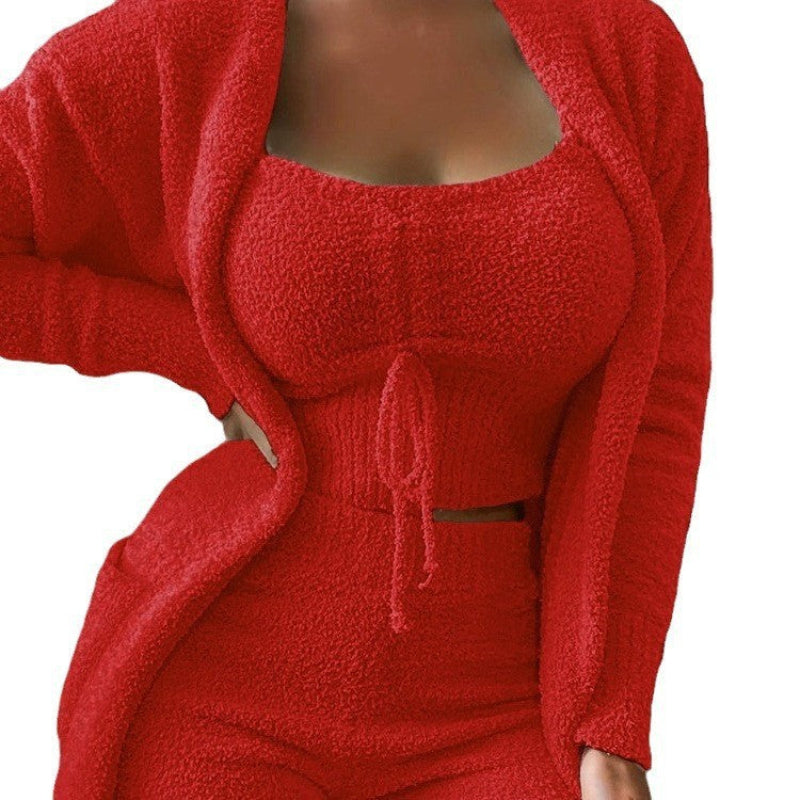 Naomi women's red three-piece matching pants set shown in a front close-up, featuring a fitted square-neck crop top with a center drawstring tie, coordinating long-sleeve open-front cardigan with curved trim detailing, and matching high-waisted pants in textured ribbed fabric.