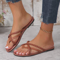 Video showing dark brown and white women’s braided cross-strap toe-ring flat sandals worn on the feet, highlighting the woven strap pattern, open-toe design, flat profile, brown footbed, and overall fit from multiple natural angles.