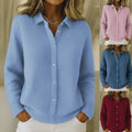 Video showing women's button-down knit sweater in light blue, pink, blue and burgundy color options