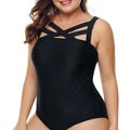 Close-up of the Sasha women's black one-piece swimsuit showing multiple slim black straps crossing diagonally over the upper chest, creating an intricate geometric neckline above the fitted solid black bodice.
