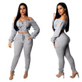 Woman shown in front and side views wearing a Grey off-shoulder lace-up cropped top with matching jogger pants and heels against a white background.