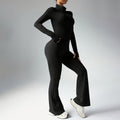 Black Sculpted Silhouette women’s long-sleeve fitness jumpsuit with flared legs shown in angled pose