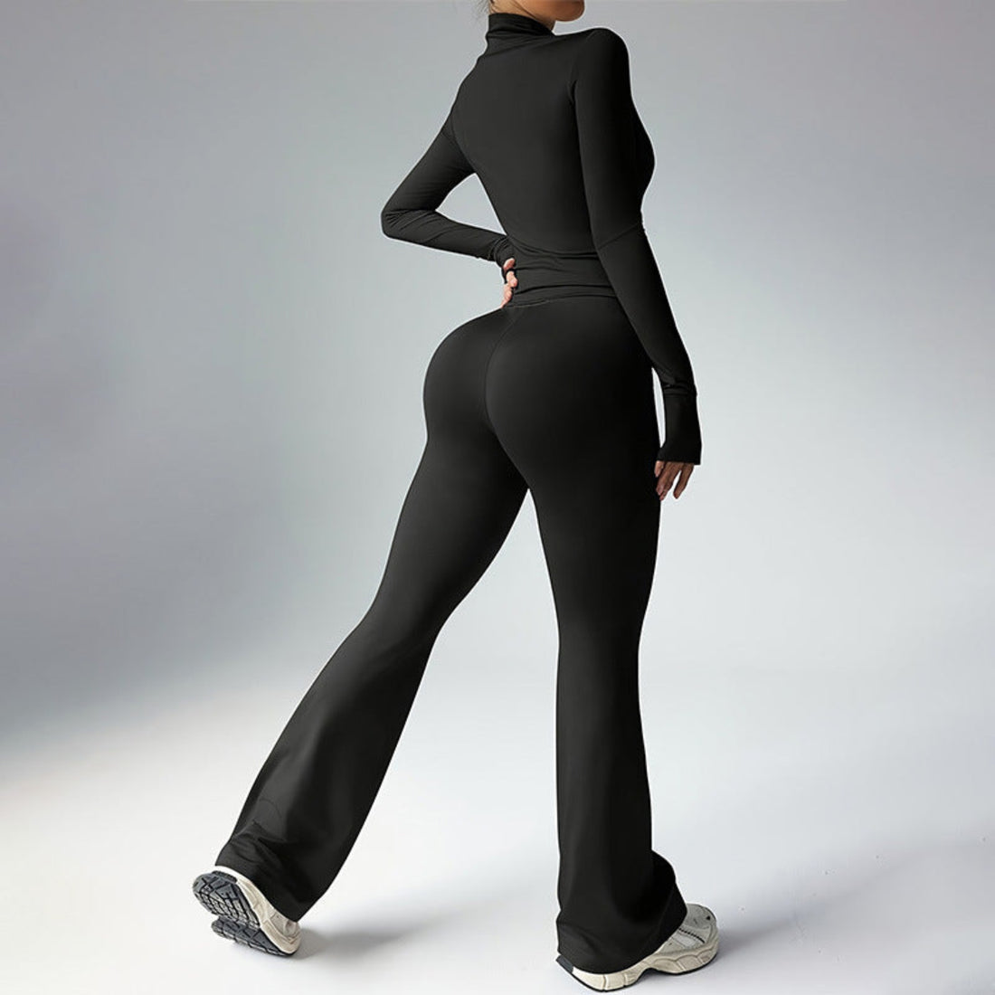 Black Sculpted Silhouette women’s long-sleeve fitness jumpsuit with flared legs