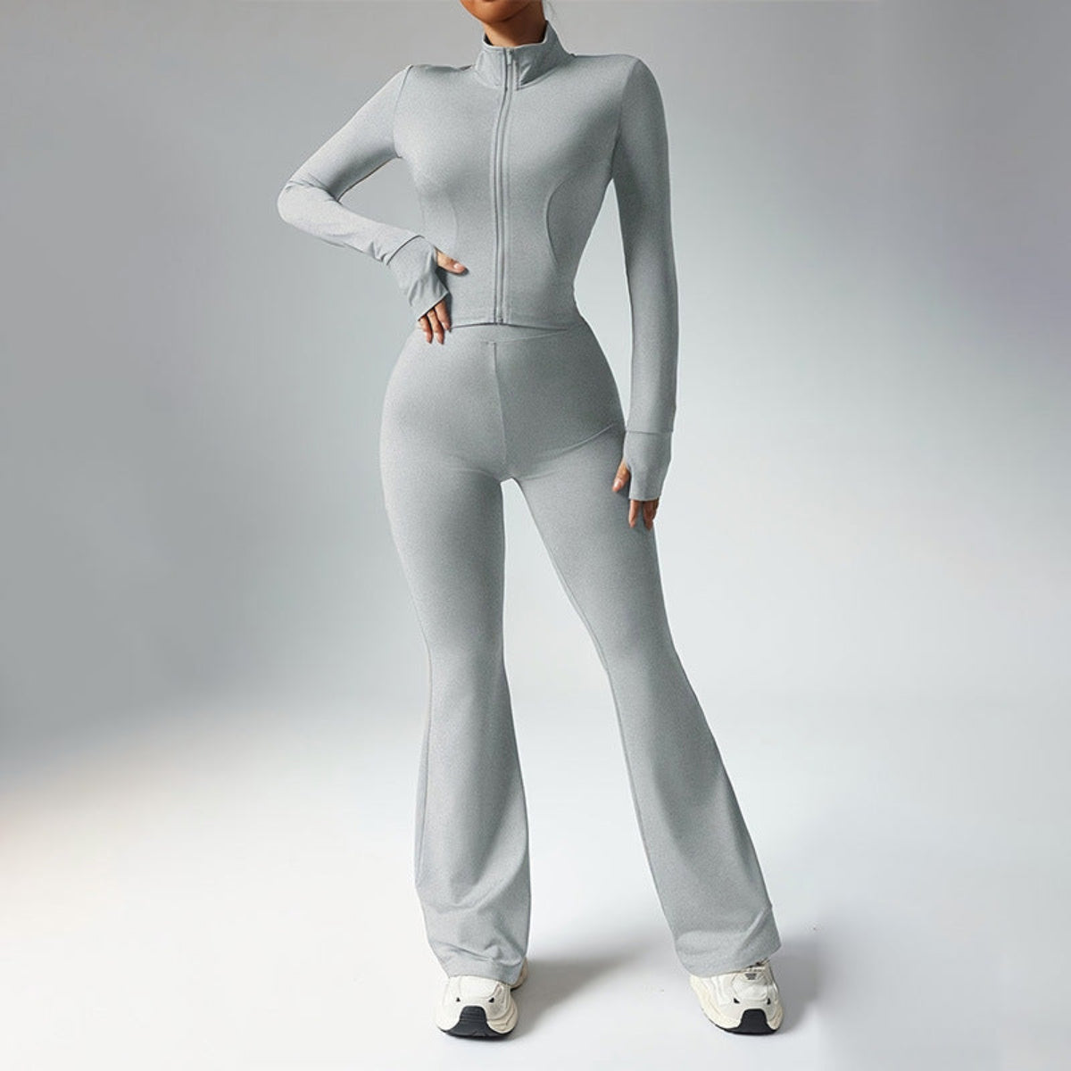 Ivory Sculpted Silhouette women’s long-sleeve fitness jumpsuit with flared legs