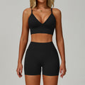 Advanced black SculptFit women’s sports bra and high-waist workout shorts set shown from the front