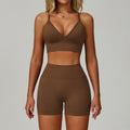 Dark coffee SculptFit women’s sports bra and high-waist workout shorts set shown from the front