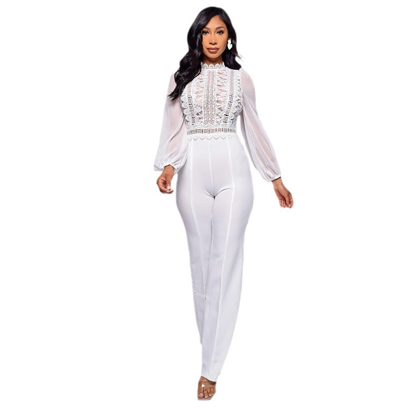 Seraphina women's elegant white evening jumpsuit shown from the front, featuring a high lace-trimmed neckline, intricate floral and geometric lace detailing across the bodice, long sheer white sleeves with gathered cuffs, a defined waist, and matching white straight-leg trousers.