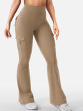 Talia women's khaki-colored flare active pants displayed from the front on a model, featuring a high-rise waistband, smooth fitted fabric along the hips and thighs, and long flared legs with a relaxed opening at the hems for a fashionable sporty silhouette.