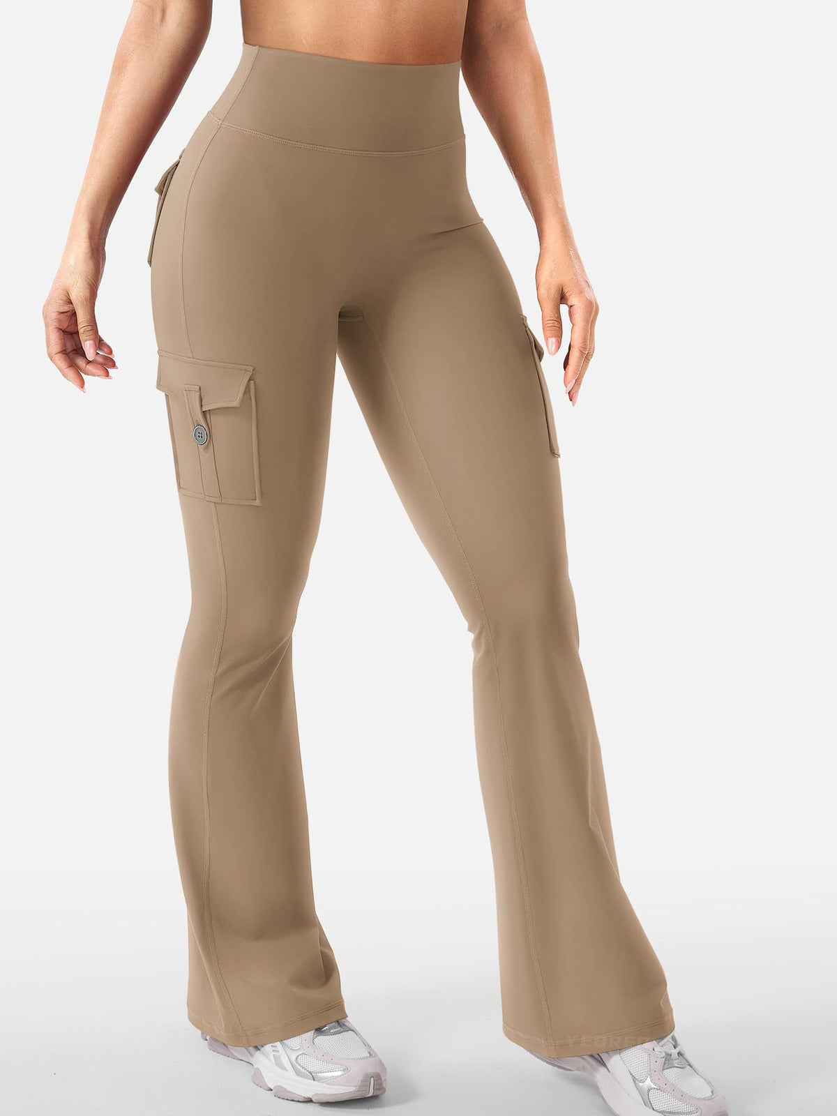 Talia women's khaki-colored flare active pants displayed from the front on a model, featuring a high-rise waistband, smooth fitted fabric along the hips and thighs, and long flared legs with a relaxed opening at the hems for a fashionable sporty silhouette.