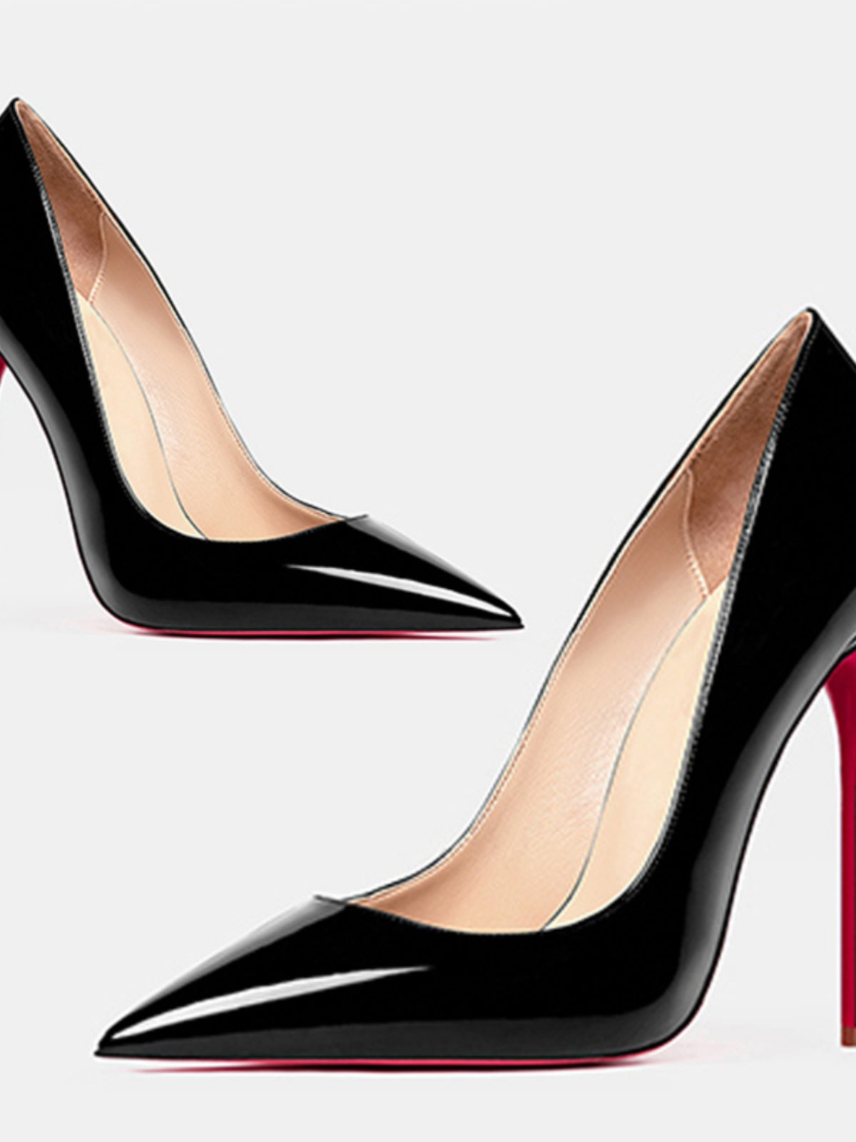 Pair of black Valentina Red-Sole Patent Pointed-Toe Stiletto Pumps featuring glossy black uppers, sharply tapered pointed toes, slim high heels, and contrasting red soles.