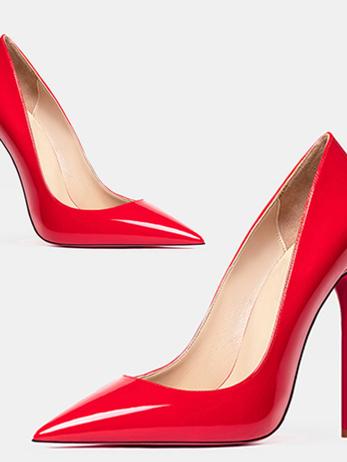 Pair of Red Valentina Patent Pointed-Toe Stiletto Pumps shown together with a glossy bright red finish, sleek pointed toes, low-cut silhouette, and ultra-thin high heels for a bold statement look.
