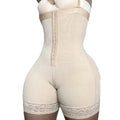Women's beige full-body shapewear with front hook-and-eye closure, tummy control and lace thigh trim shown from the front